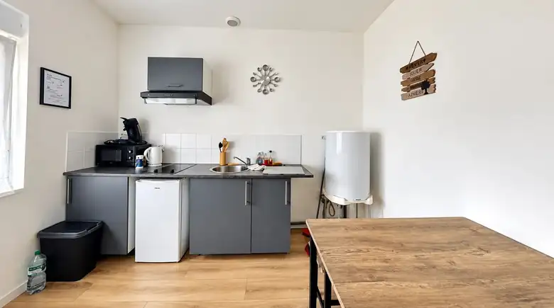 La kitchenette — Immeuble de rapport de 224m² composé de 9 lots : 5 studios, 2 T2, un garage et un local à Raismes